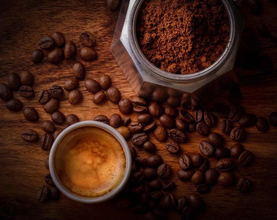 brown coffee beans beside white ceramic mug, coffee