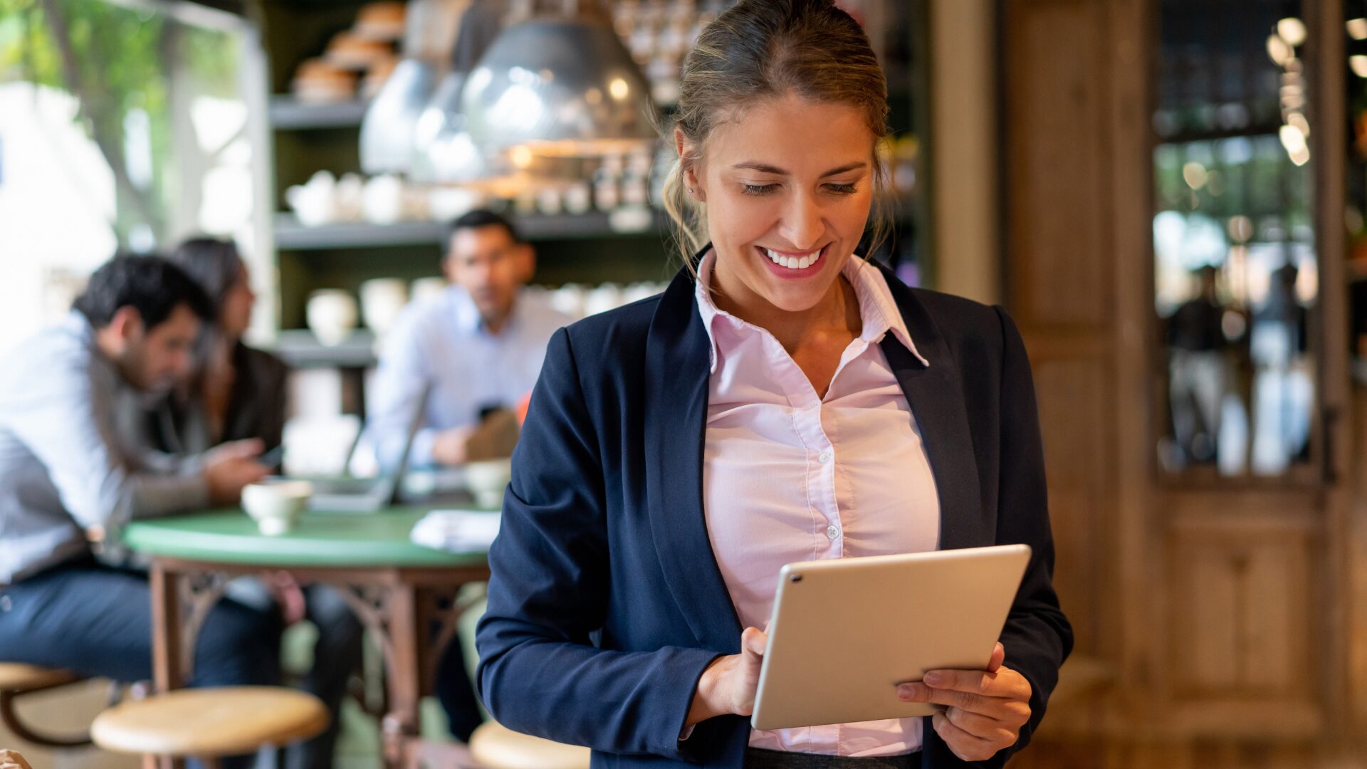 Phygital Restaurant. Woman using tablet