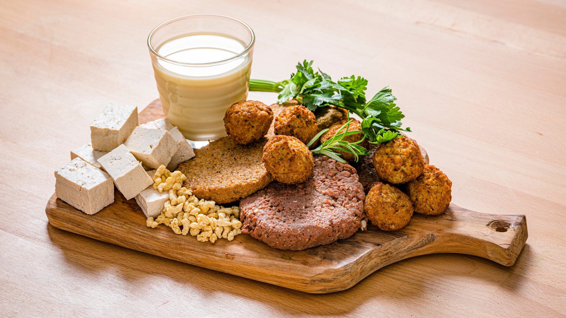 Plant-based diet with tofu and veggie burgers on a charcuterie board