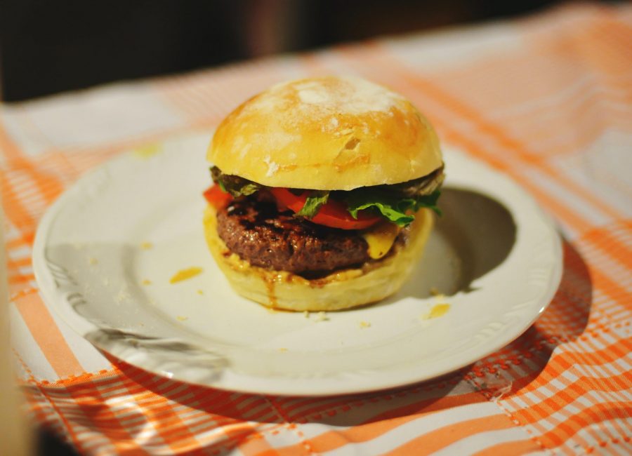 food photography of meat burger with tomatoes and lettuce