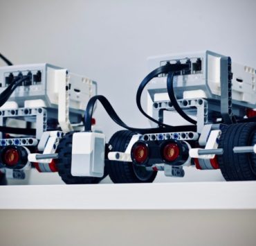 two white and black electronic device with wheels