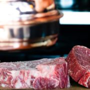 sliced meat on brown surface