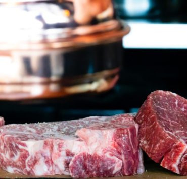 sliced meat on brown surface