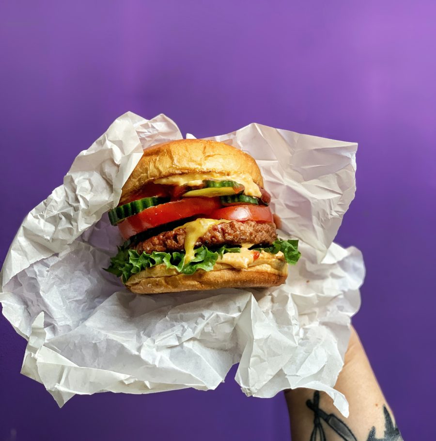 burger on white paper bag