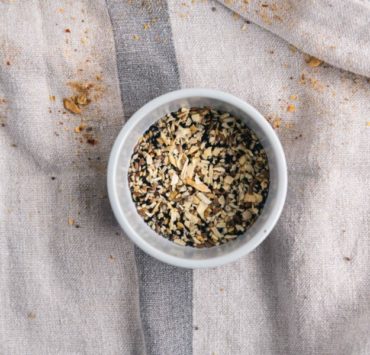 white ceramic bowl with brown seeds