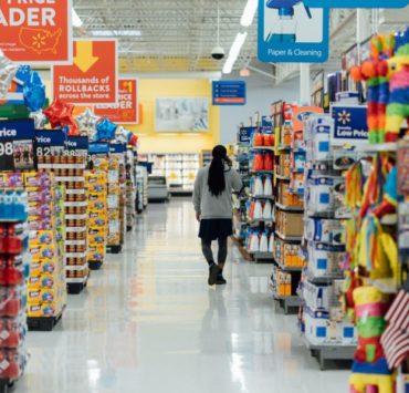 person standing between shelvings