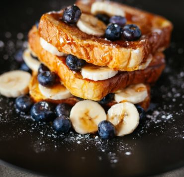 toast bread with blueberry on black plate