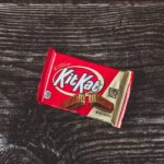 kitkat chocolate pack on black textile