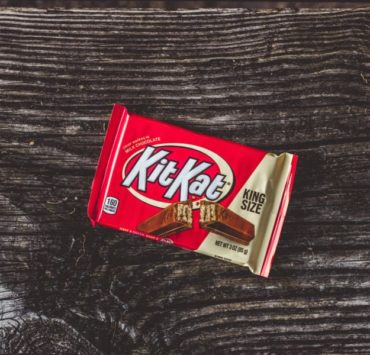 kitkat chocolate pack on black textile