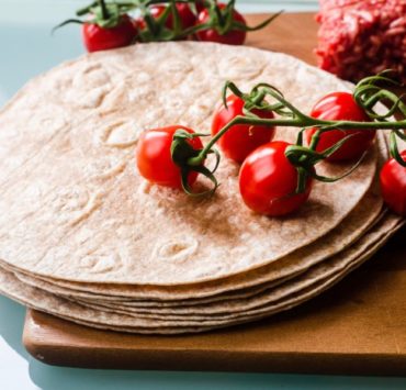 red cherries on white round cake