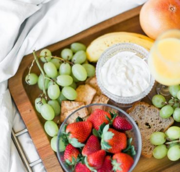variety of fruits with dip on tray