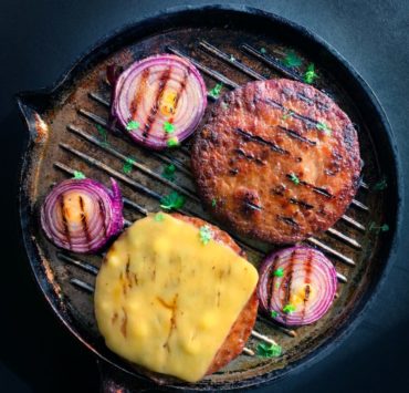 cooked meat on black round plate
