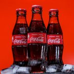 coca cola bottles on black table
