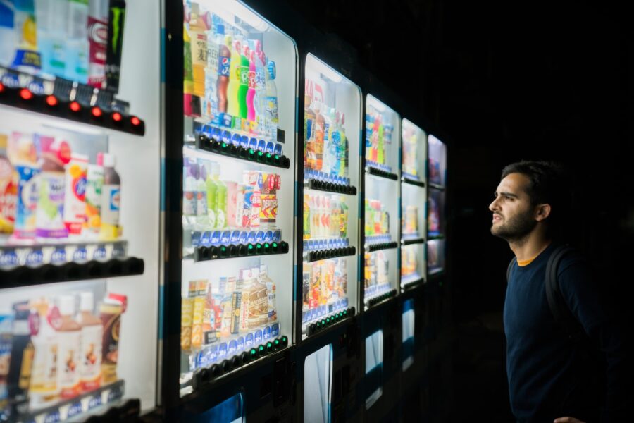 inflation diet, man on front of vending machines at nighttime