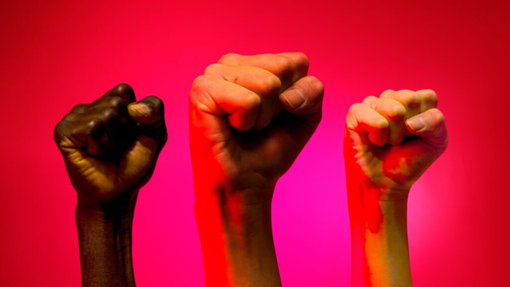 Food strikes. Raised fists in protest