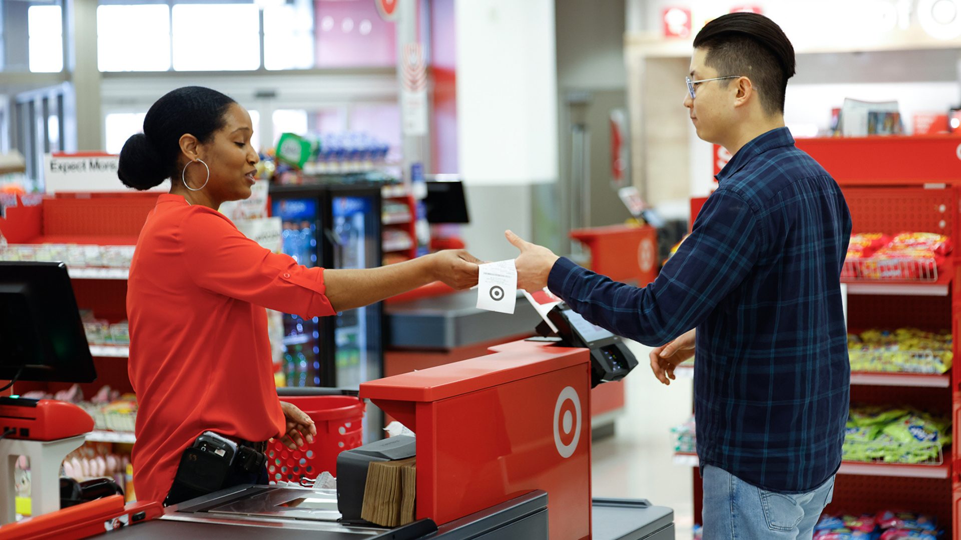 Target Stores Person at Checkout receiving receipt