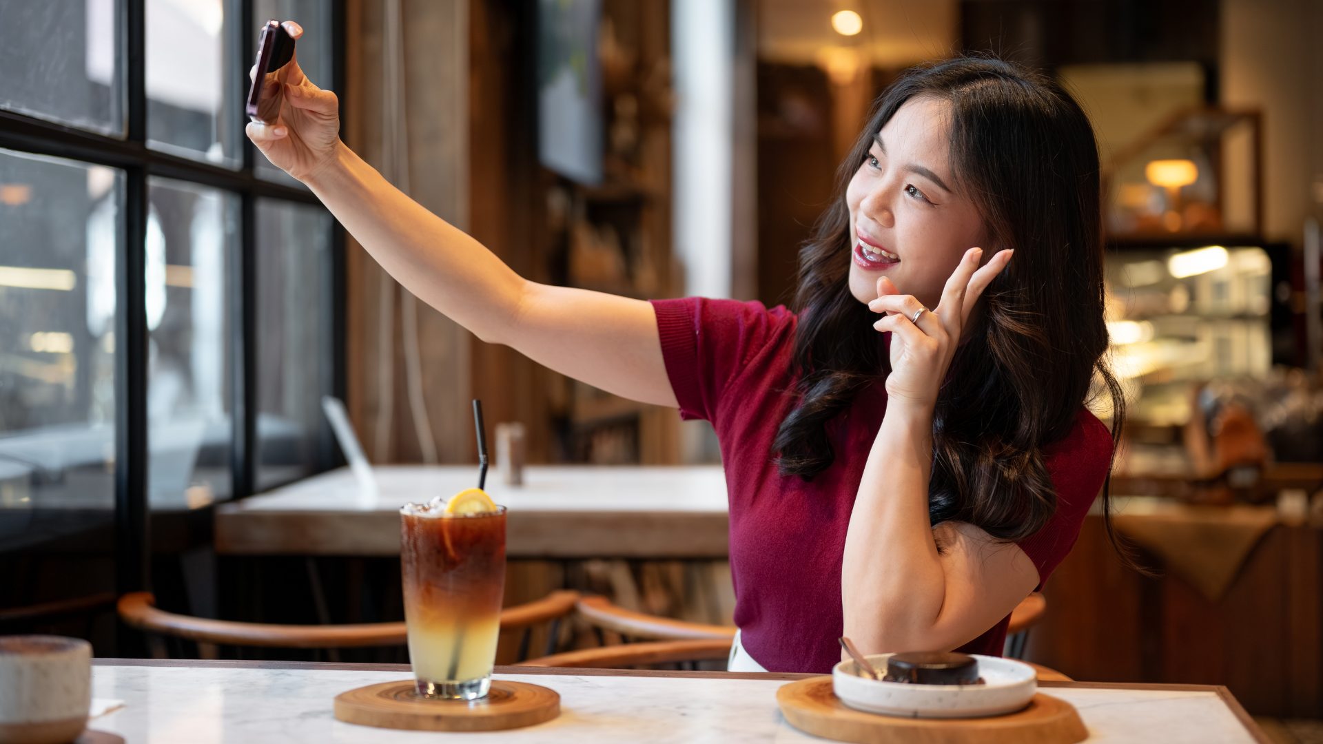 Gen Z Taking Selfie in Restaurant