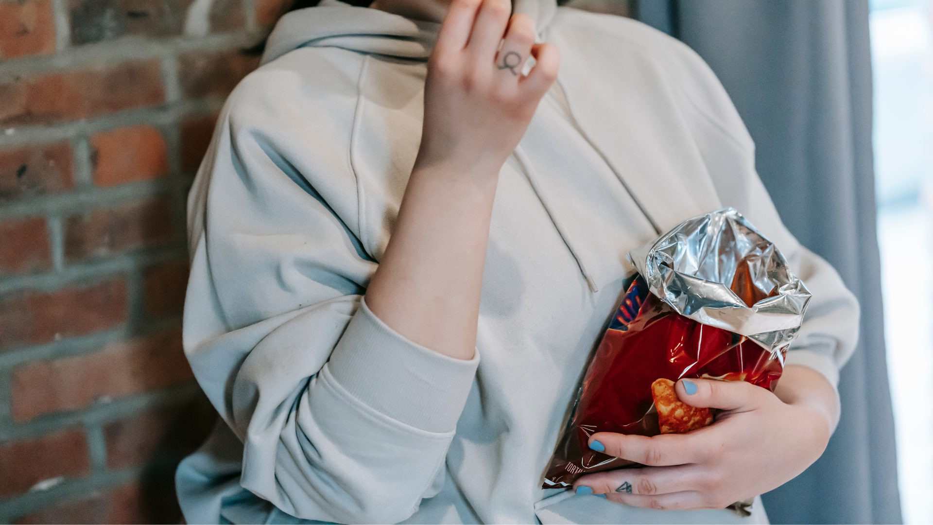 Person Holding PepsiCo Doritos