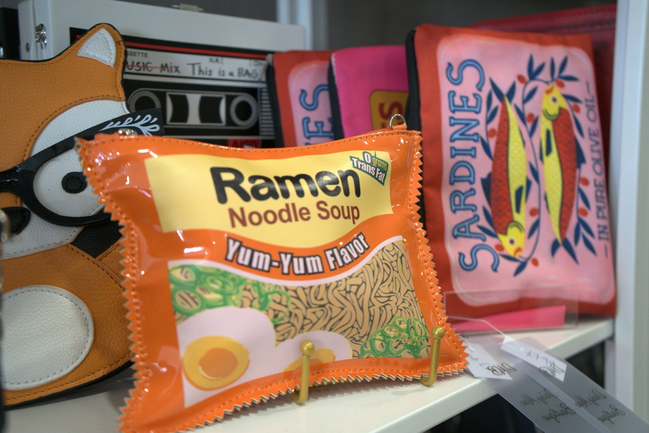 Ramen-themed items and other knick-knacks on a shelf.
