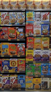 a shelf of cereal boxes