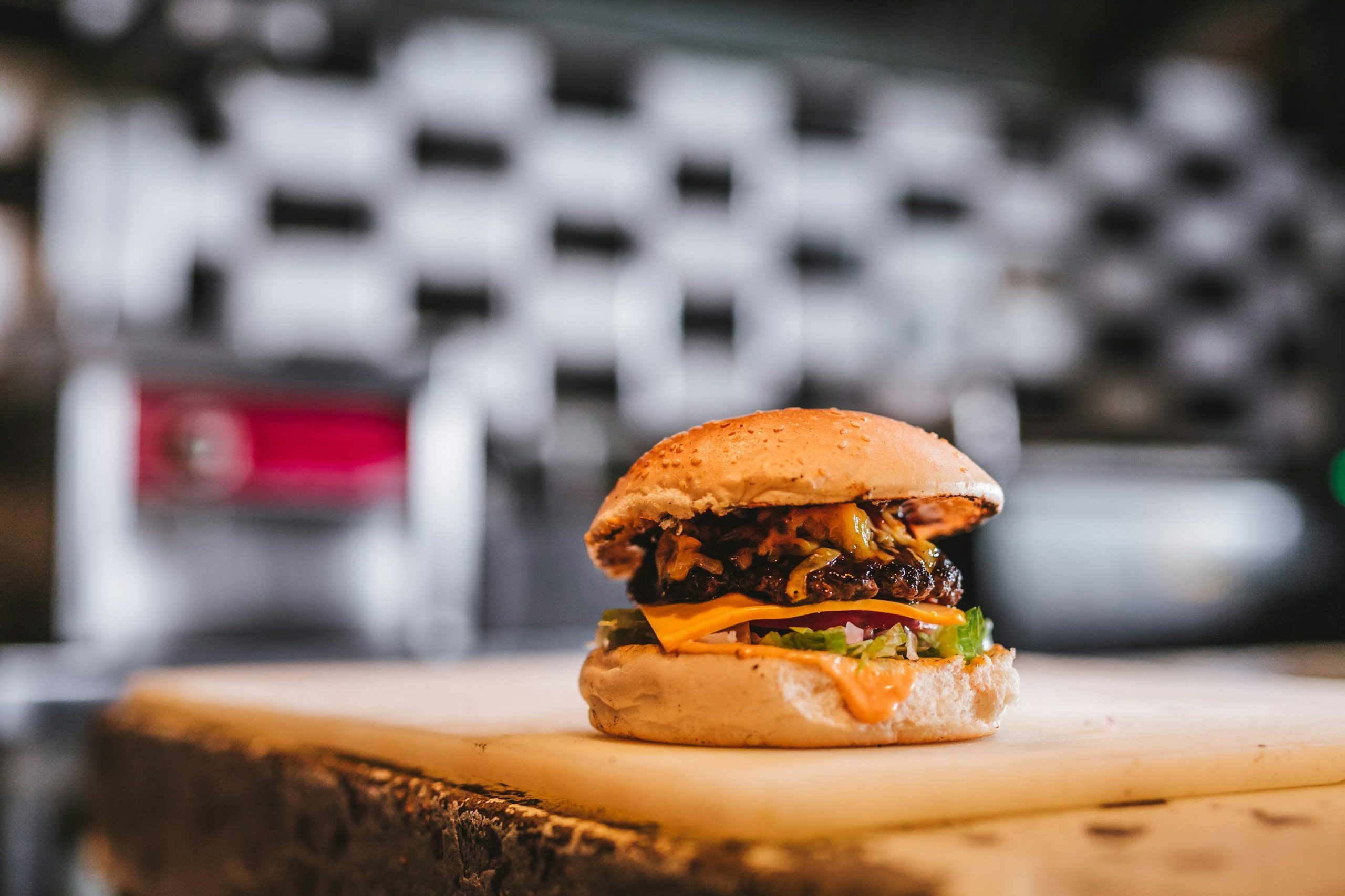 a hamburger sitting on top of a cutting board